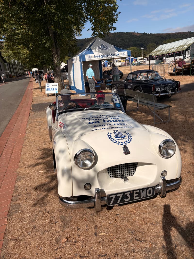 TS2, a white 1953 Triumph TR2 registered 773 EWO, parked on the grass at Car Club Fest