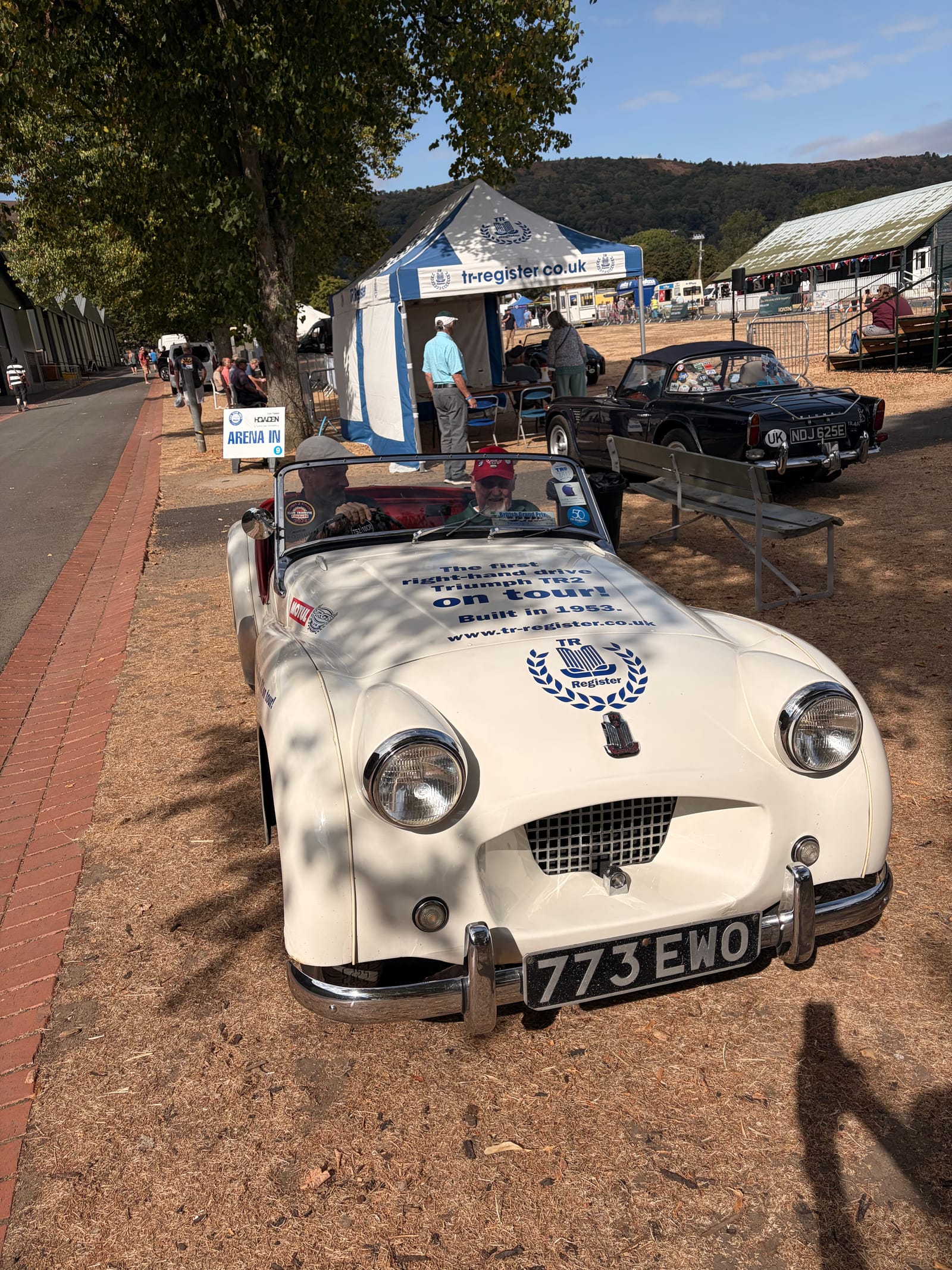 TS2, a white 1953 Triumph TR2 registered 773 EWO, parked on the grass at Car Club Fest