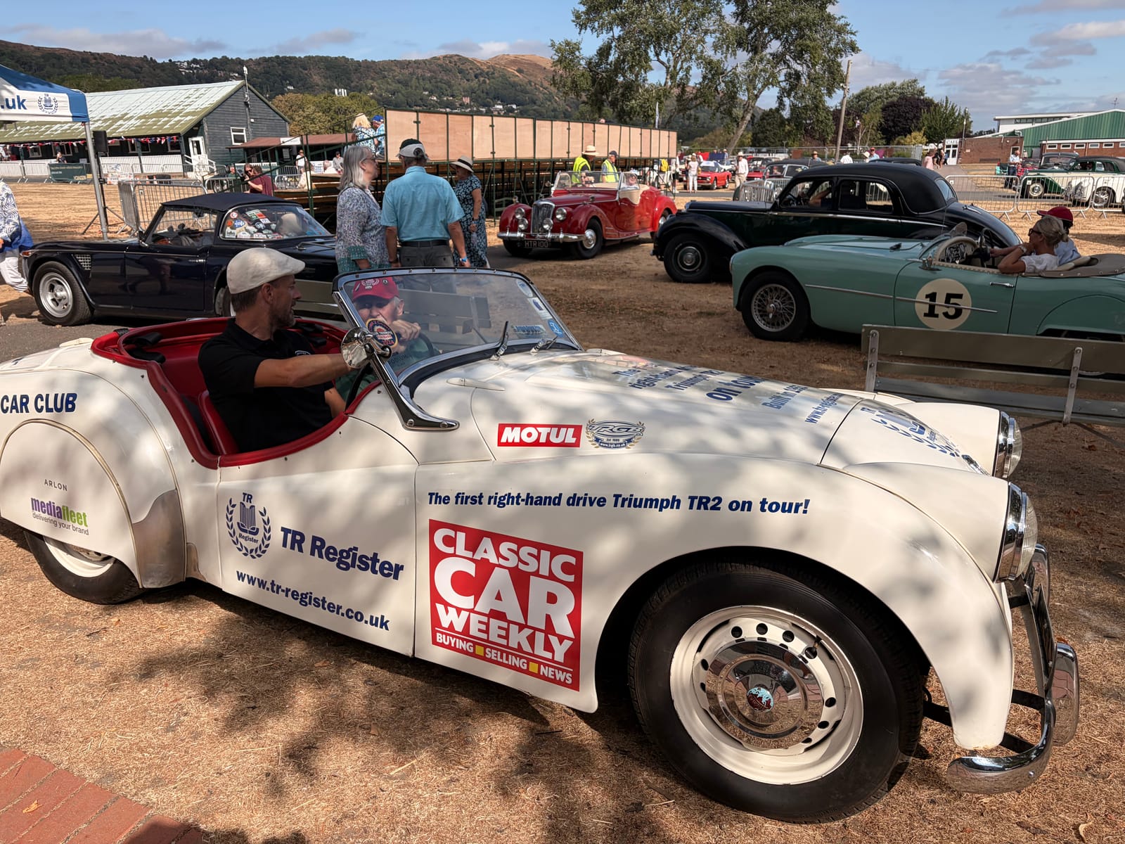 TS2 parked among the show cars at Malvern, the hills rising behind