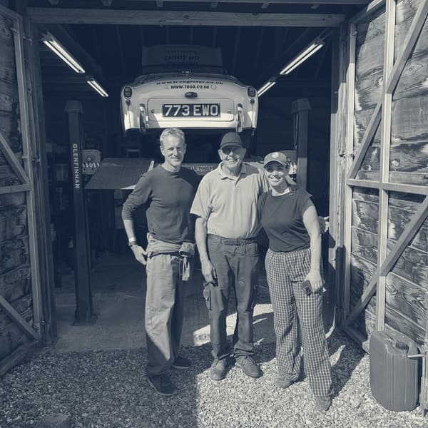 The three of us outside the open garage, TS2 up on the lift behind
